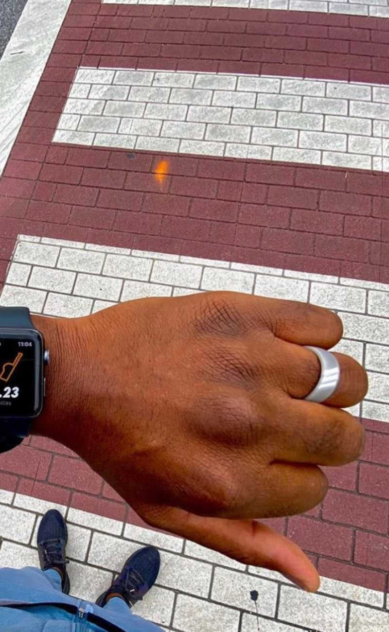 man running in a city wearing silicone rings.