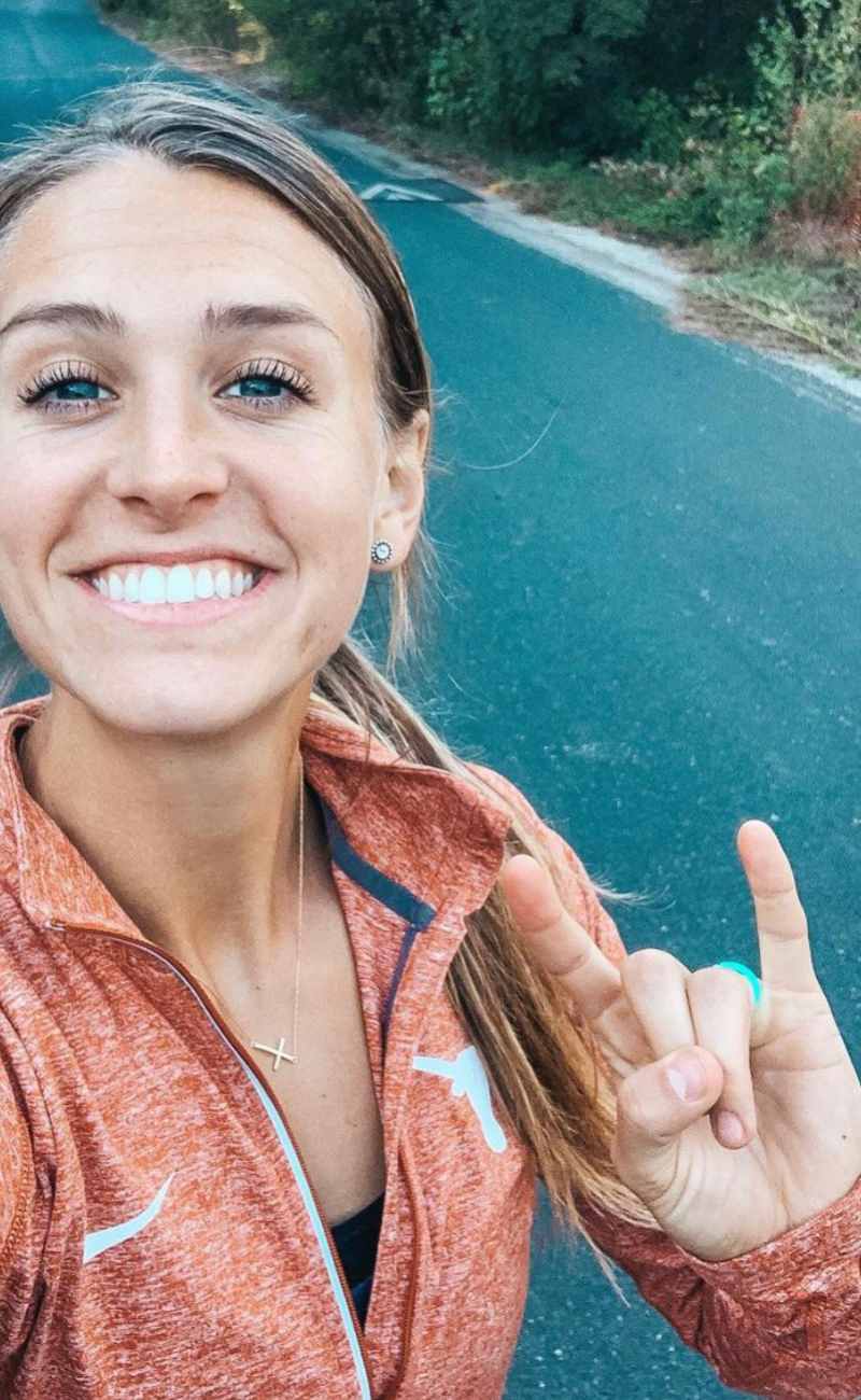 women athlete smiling at the camera wearing silicone rings.