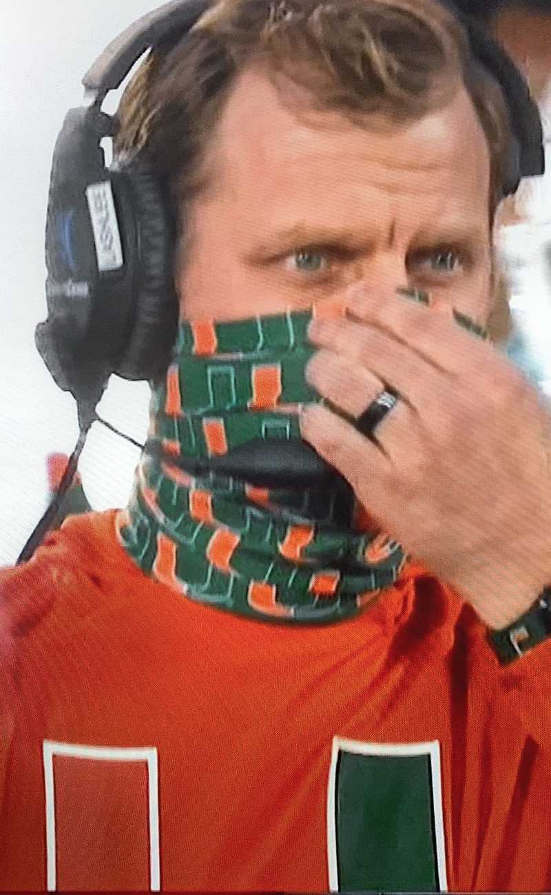 a college football coach wearing silicone rings.
